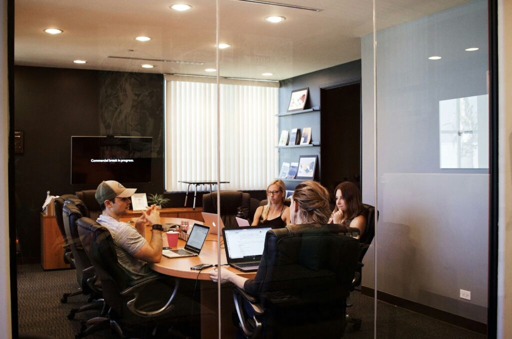 4 agency workers having a meeting in an office